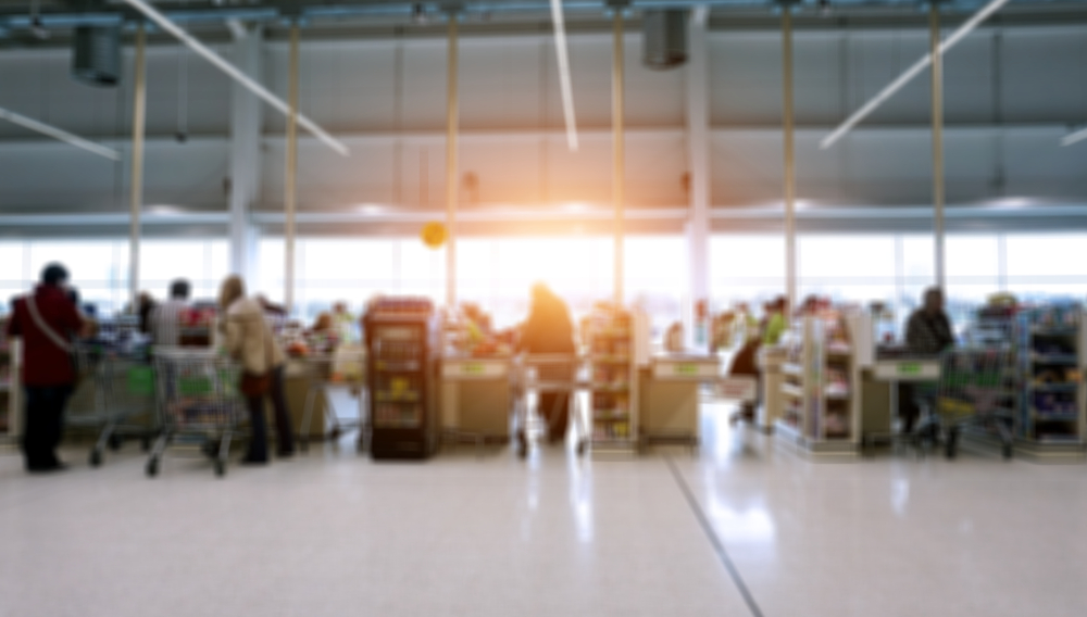 Tesco and Sainsbury's have been named among a number of supermarket giants linked to multiple migrant worker abuses within the UK.